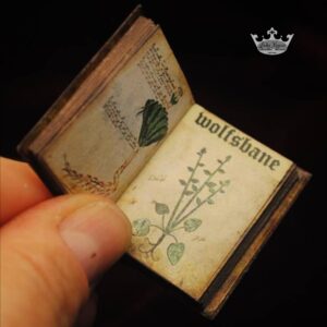 Open miniature Wolfsbane book