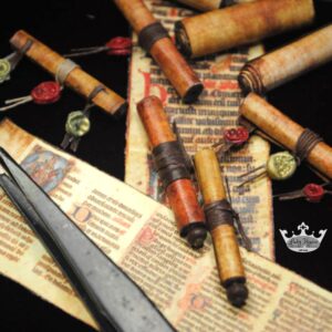 open miniature scrolls with tweezers