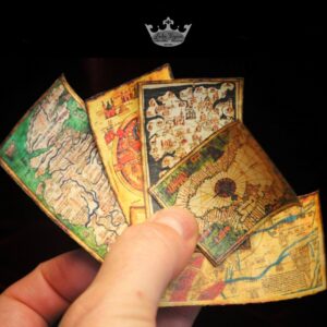 hand holding miniature medieval maps